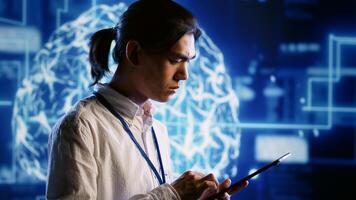 Certified engineer works with artificial intelligence computerized model simulating human brain. Licensed specialist looks at AI visualization of machine learning algorithms using pattern recognition photo