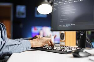 Hardware expert using software programming to ensure server security, working with binary code and html script on terminal window. IT technician engineer develops system database protection. photo