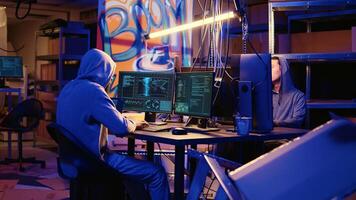 Hackers doing computer sabotage using encryption trojan ransomware in hidden base. Cybercriminals demanding ransom money from victims in exchange for access to their data photo