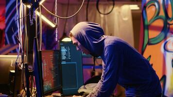 Hackers hearing police sirens while using network vulnerabilities to exploit servers, running to not get caught hacking computer systems at night, escaping law enforcement after breaching networks photo