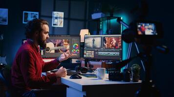 editor filming online tutorial about editing color grading and lighting. Post production expert in home studio recording guide for internet audience about working with raw footage photo