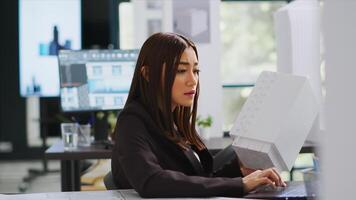 Developer analyzing 3d building model at realty office, examining measurements for the actual construction scale. Engineer calculating industrial lines and elements on laptop blueprint draft. photo