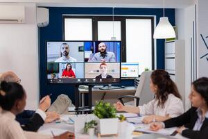 Team working by group call share ideas brainstorming negotiating use conference. Business people talking to webcam, do online conference participate internet brainstorming, distance office discussion. photo