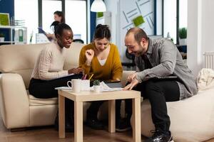 Happy leader motivate diverse employees business team give high five together, excited office workers group and coach engaged in teambuilding celebrate success good results reward in teamwork concept photo