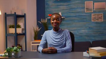 Black business woman talking in front of camera having call with partners. Pov of african freelancer working with remotely team discussing during online conference meeting using internet. photo