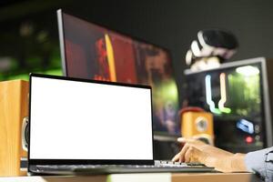 Mockup laptop display next to man playing FPS singleplayer videogame, shooting enemies. Isolated screen notebook near gamer using gun to hit targets in SF game, close up shot photo