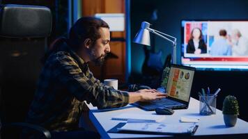Man concerned about statistical data financial graphs on laptop screen while researching data for company project. Freelancer unhappy about business graphic figures, feeling stressed, camera A photo