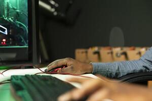 Gamer using keyboard and mouse to play FPS singleplayer videogame on PC, enjoying leisure time. Person in apartment at night using high tech computer peripherals to destroy enemies, close up photo