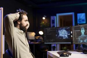 Artificial intelligence entity with anthropomorphic body escaping control of creator, shocking software developer. AI robot gaining humanoid form inside computer, surprising bewildered engineer photo