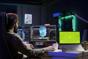 Developer being asked existential questions by awaken AI gaining consciousness, isolated screen device. Man communicating with artificial intelligence emulating humans, chroma key notebook photo