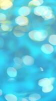 Bright and colorful bokeh lights create an abstract pattern on a blue-green background. Surface of calm blue water. Background, Wallpaper, Design Element. Vertical photo