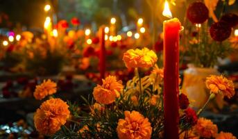 Marigold flowers and candles on cemetery on the Day of the Dead. Lit candles in graveyard setting. Concepts of remembrance, cultural celebration, Traditional Mexican altar Dia de los Muertos photo