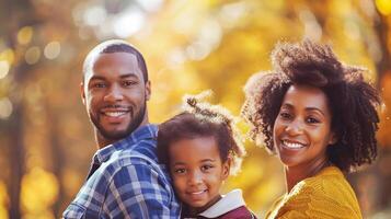 African American family in autumn park. Happy black parents and child in fall scenery. Concept of family bonding, nature, seasonal beauty photo