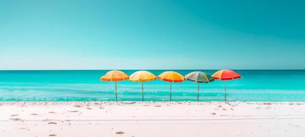 Colorful beach umbrellas lined up on a sandy beach with clear blue skies and bright sunlight. Concept of beach resort, summer vacation, sun protection, and leisure. Banner. Space for text photo