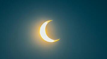 Partial solar eclipse against a dark sky. Bright crescent sun during an eclipse. Concept of astronomy, celestial event, solar phenomena, and natural wonder photo