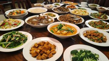 Assortment of Thai dishes on banquet table, set in a traditional dining setting. Thai meal. Concept of Asian dining experience, cultural feast, and authentic cuisine. photo