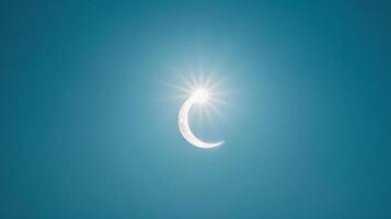 Bright crescent sun during a partial eclipse against a dark sky. Partial solar eclipse against a dim sky. Concept of astronomical event, solar observation, celestial phenomena, and sky watching photo
