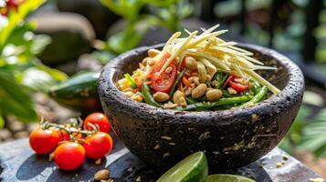 Fresh green papaya salad in bowl garnished with roasted peanuts. Som Tum with cherry tomatoes and green beans. Concept of Thai cuisine, Asian traditional dish photo