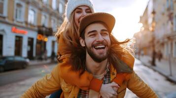 Happy Caucasian couple enjoying piggyback ride in a city street at sunset. Romance, joy, urban adventure, affection concept photo