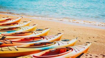 Row of colorful kayaks on a sandy beach against clear blue waters. Beachside leisure equipment. Concept of water sports, beach activity, and vibrant summer fun photo