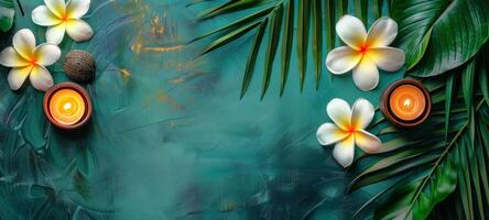 Plumeria flowers with candles on a textured green surface. Frangipani blossoms and lit candles creating a serene spa setting. Concept of relaxation, meditation, and wellness ambiance. Copy space photo