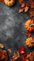 Autumn pumpkins and leaves on dark textured background. Fall gourds and foliage arranged on a black surface. Seasonal decoration, autumnal design, nature's colors, fall concept. Copy space. Vertical photo