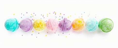 Assorted colorful bath bombs isolated on a clean white background. Pastel-colored bath bombs arranged in a row. Concept of self-care, bathing essentials, relaxation, and home spa. photo