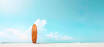 Minimalist photo of a lone surfboard standing against a blue sky on a deserted beach. Concept of summer, surfing, beach activities, and coastal lifestyle. Space for text. Banner