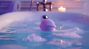 Purple bath bomb dissolving in a bathtub with soft candle lighting. Fizzy bath bomb creating a luxurious bath experience. Concept of indulgence, wellness and relaxation in a spa setting. photo