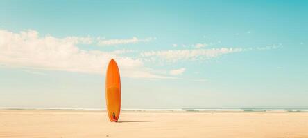 Vertical surfboard on beachfront. Standing surfboard on sandy shore. Concept of watersports, beach vacation, ocean leisure, and surfing culture. Copy space. Banner photo