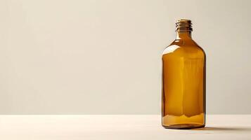 Amber glass bottle on a neutral background. Minimalist design, empty bottle, packaging concept, simplicity and elegance. Mockup. Copy space photo