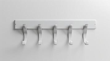 White wall-mounted coat rack with five hooks in a minimalist design. Home organization, storage solution, modern interior, simple design photo