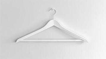 White Clothes Hanger on Plain White Wall. Concept of Organization, Minimalism, Simplicity, Interior Design photo