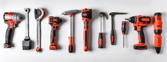 Assortment of red and black hand tools on a white background. Concept of tools, construction, DIY projects, and home improvement essentials photo