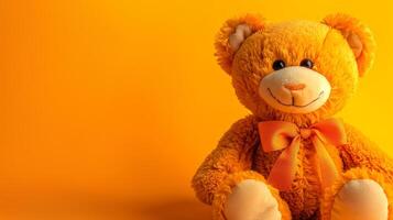 Fluffy orange bear with bowtie against orange background. Cute stuffed toy for children. Concept of playtime, childhood, comfort, softness. Copy space photo