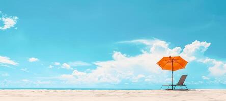 Beachside setup with umbrella and chair. Lone umbrella and chaise lounge on sandy coast. Concept of solitude, tranquil beach day, leisure, and sunbathing. Banner. Copy space photo