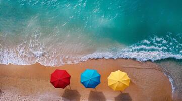 Colorful Beach Umbrellas on Sandy Shore with Ocean Waves photo