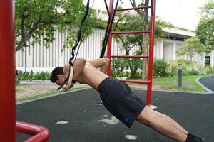 Asian men practicing swimming and polo and stretching and resting for water sports. photo