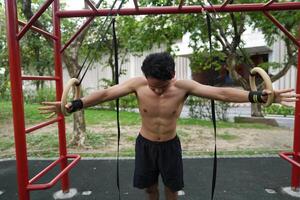 Asian men practicing swimming and polo and stretching and resting for water sports. photo