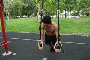 Asian men practicing swimming and polo and stretching and resting for water sports. photo