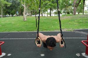 Asian men practicing swimming and polo and stretching and resting for water sports. photo