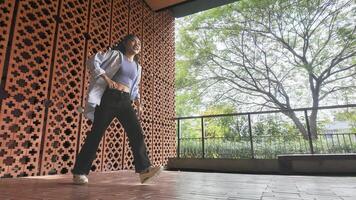 Asian girl dancing hip hop having fun With brightness and cheerfulness in the park area photo