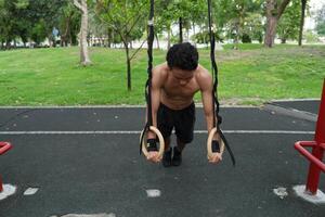 Asian men practicing swimming and polo and stretching and resting for water sports. photo