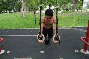 Asian men practicing swimming and polo and stretching and resting for water sports. photo