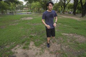 Male soccer players practice using the ball in the park field diligently and happily. photo