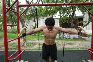Asian men practicing swimming and polo and stretching and resting for water sports. photo