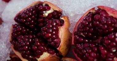 Pomegranate juice. Freshly squeezed pomegranate juice wave is flowing into a jug in slow motion video