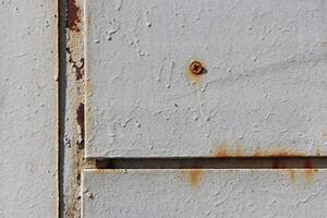 Rust White Painted Wall Texture Fragment. Screw. photo
