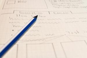 Online shop single page prototyping sketch with blue pencil. Web photo