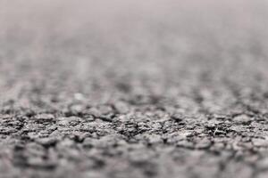 Asphalt Road focused foreground with blurred background. photo